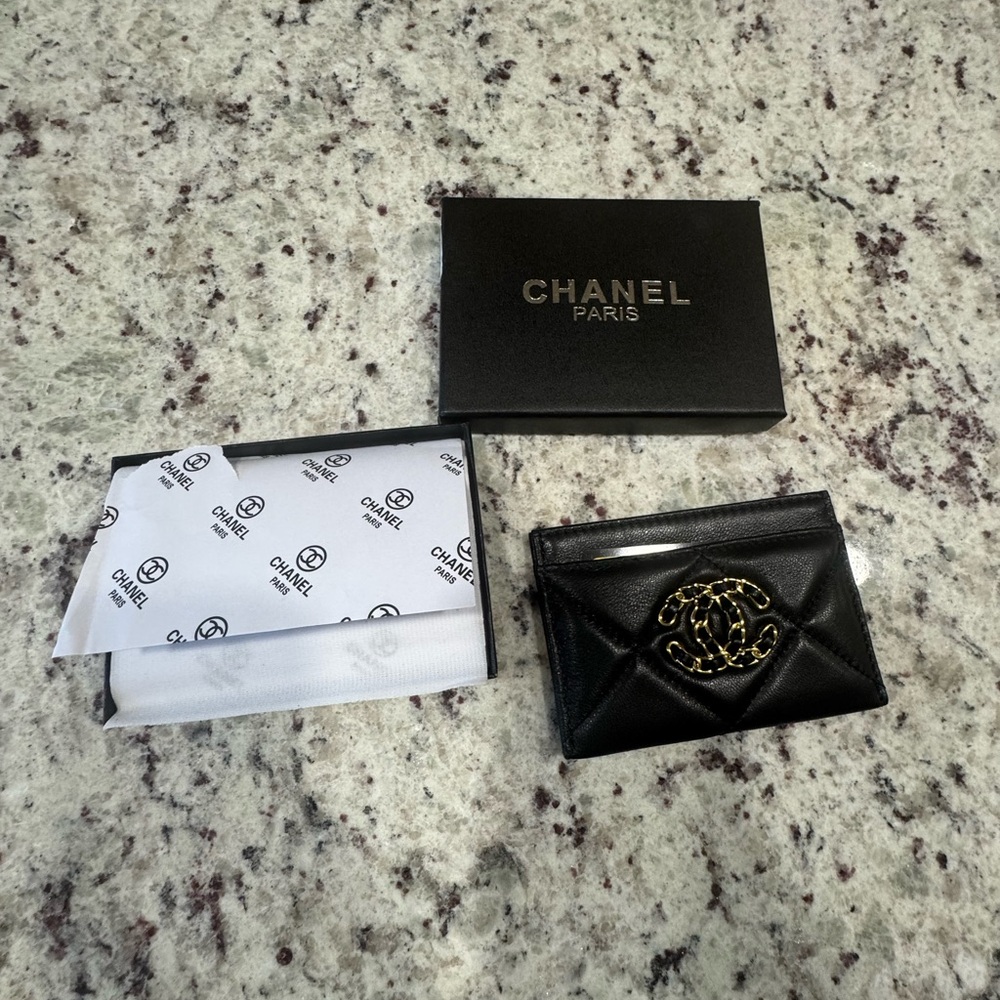 CHANEL Black Quilted Card Holder with Gold Logo